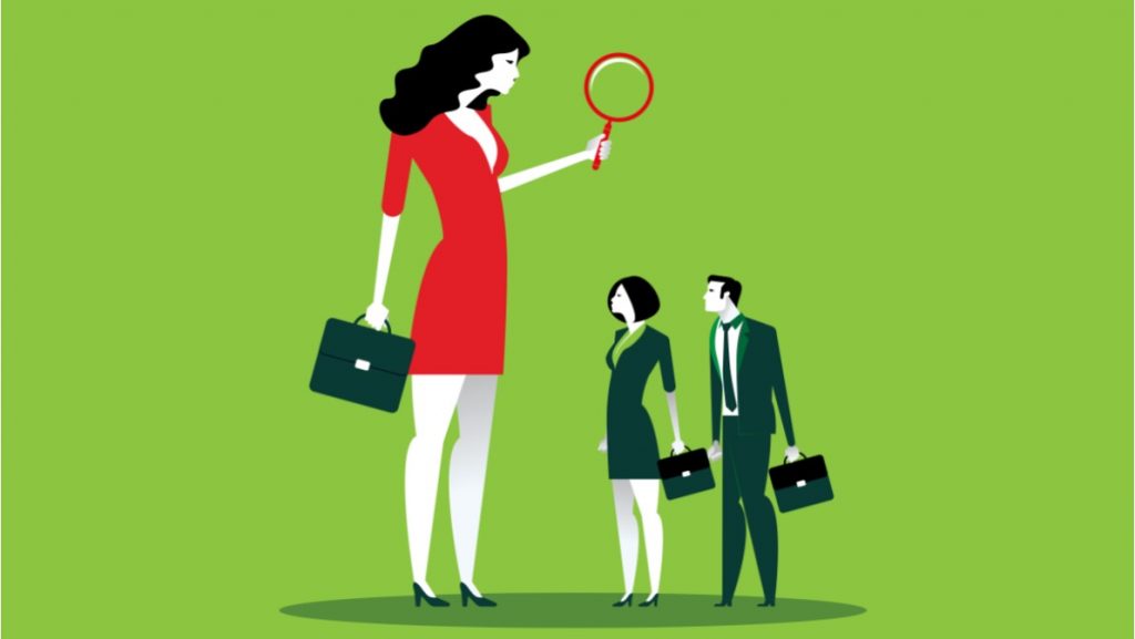 Bully boss scrutinising staff